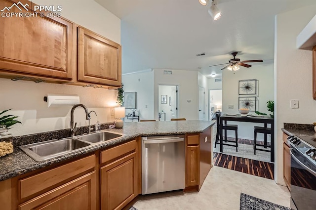 kitchen featuring sink, ceiling fan, range with electric stovetop, stainless steel dishwasher, and kitchen peninsula