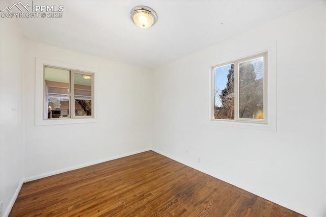 empty room with hardwood / wood-style floors