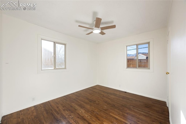 spare room with ceiling fan and wood-type flooring