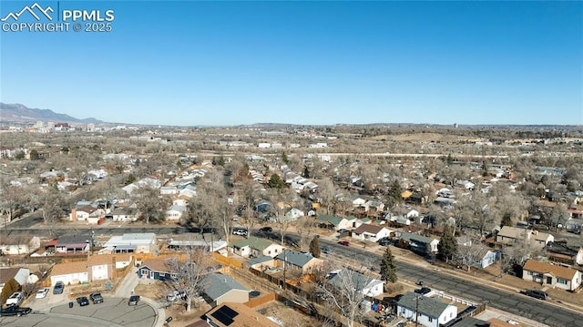 birds eye view of property with a mountain view