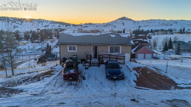 snow covered property with a mountain view