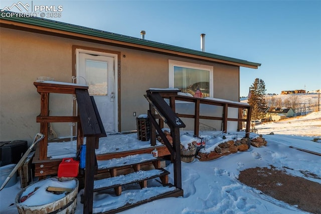 view of snow covered property entrance