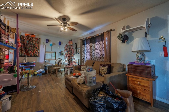 living area with dark hardwood / wood-style floors and ceiling fan