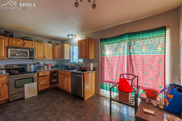 kitchen with sink and appliances with stainless steel finishes