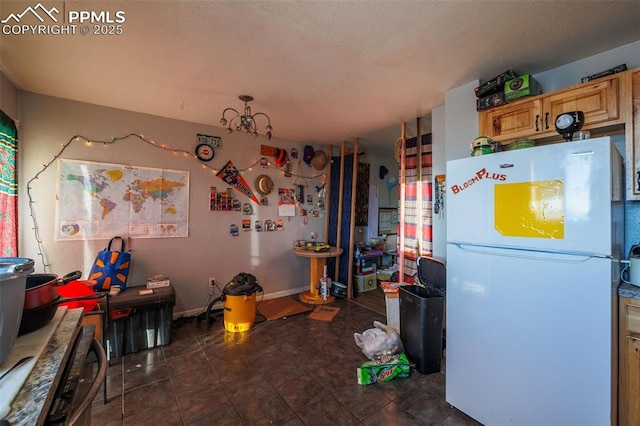 kitchen with white fridge and light brown cabinets