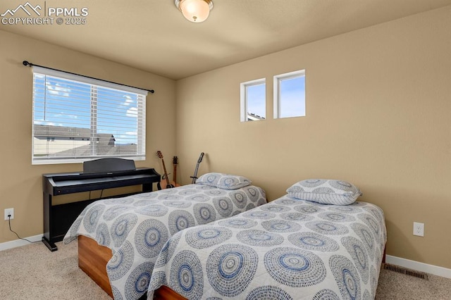 bedroom featuring light colored carpet