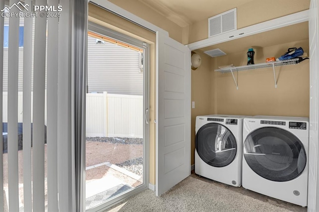 laundry room with washer and dryer