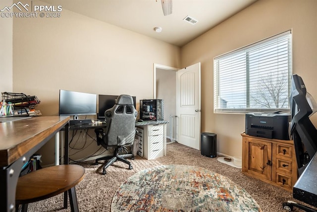 carpeted home office with ceiling fan