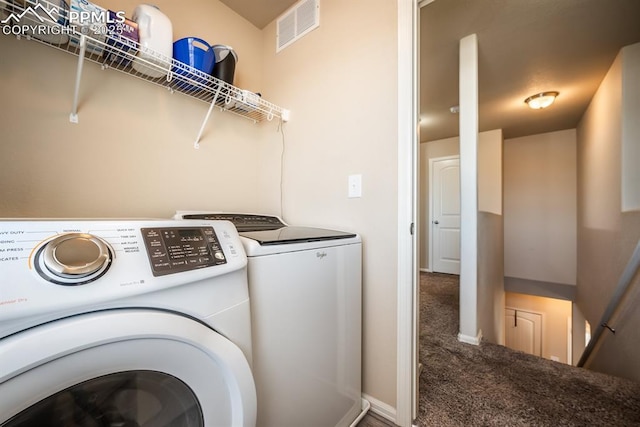 washroom featuring carpet and washer and dryer