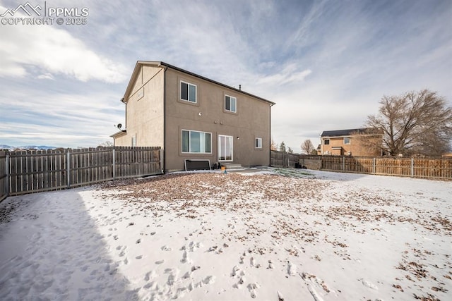 view of snow covered property