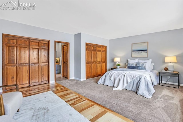 bedroom with light hardwood / wood-style floors and a closet