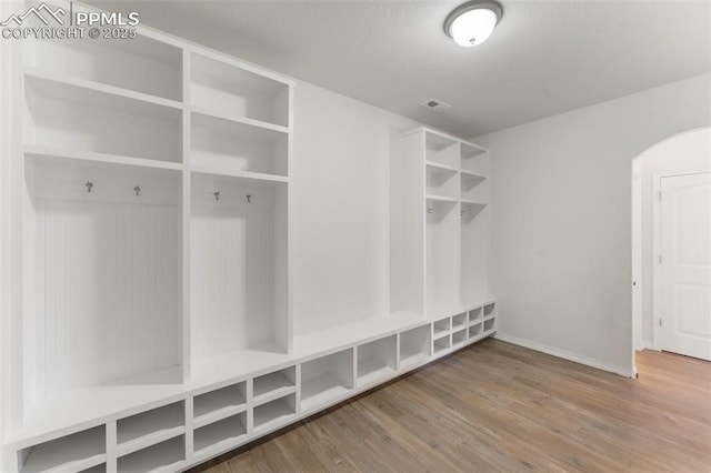 mudroom with hardwood / wood-style floors