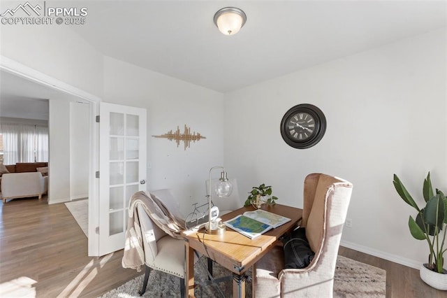 dining space with hardwood / wood-style flooring