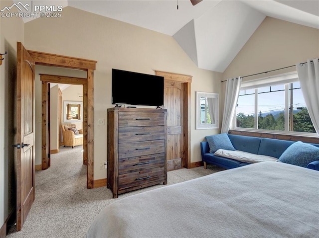 bedroom featuring light carpet, lofted ceiling, and baseboards