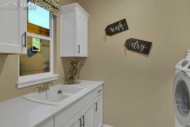 washroom with cabinets and sink