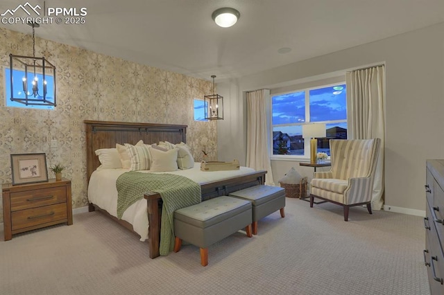 carpeted bedroom with a notable chandelier