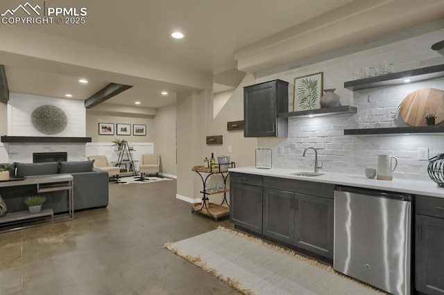 kitchen featuring tasteful backsplash, sink, and refrigerator