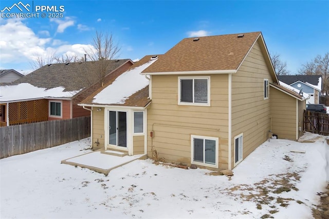 view of snow covered house