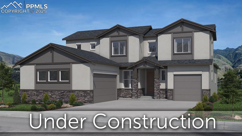 view of front of house featuring a mountain view and a garage