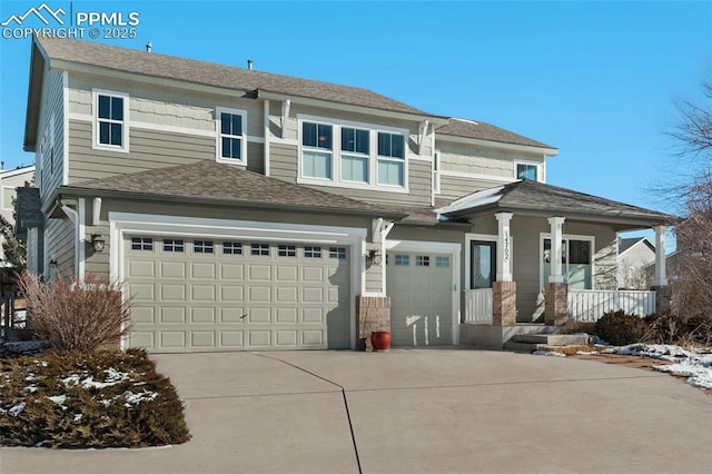 view of front of property with a garage and a porch