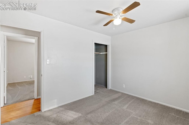 unfurnished bedroom with ceiling fan, light colored carpet, and a closet