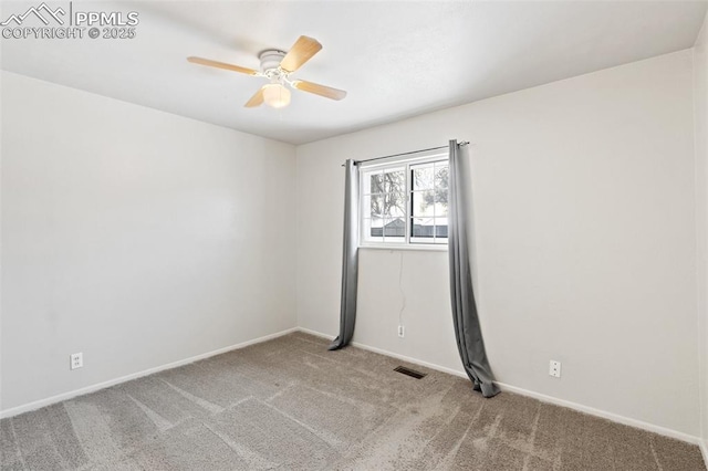 spare room with light carpet and ceiling fan