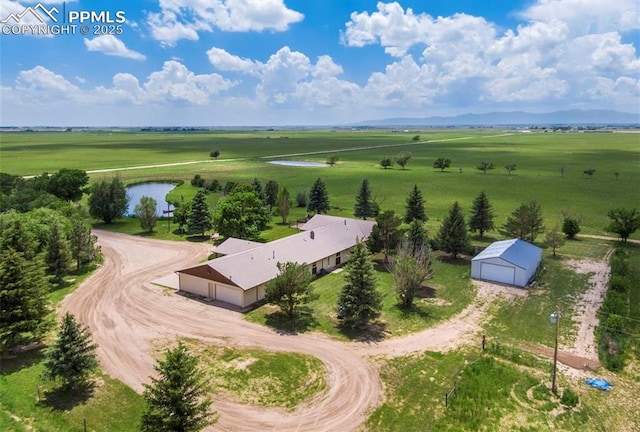 drone / aerial view with a rural view and a water view