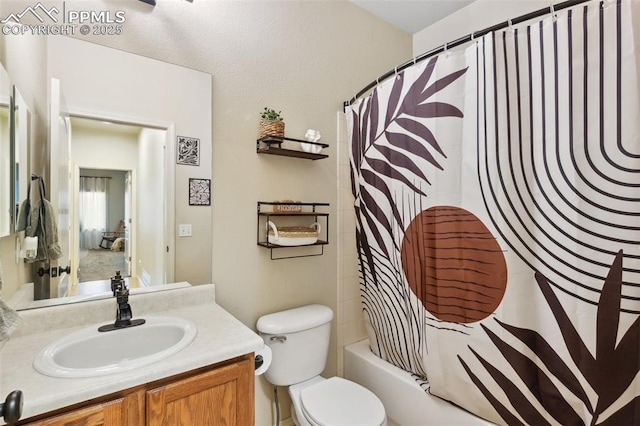 full bathroom featuring vanity, shower / bath combination with curtain, and toilet