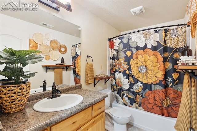 full bathroom with shower / bathtub combination with curtain, vanity, toilet, and a textured ceiling