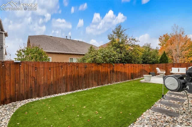 view of yard with a patio area