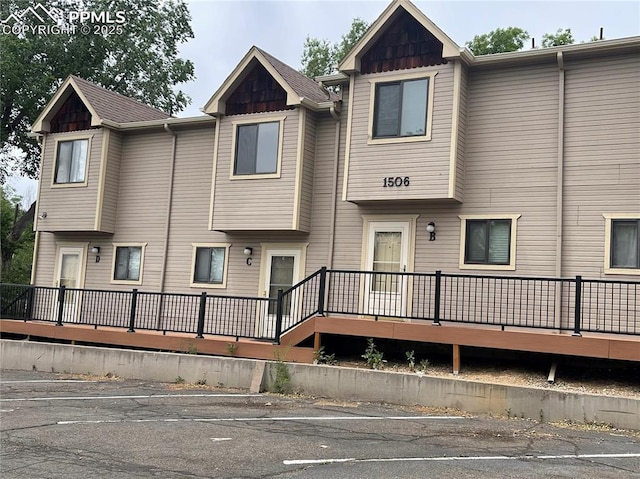 rear view of house with a wooden deck