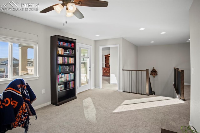 living area with light colored carpet