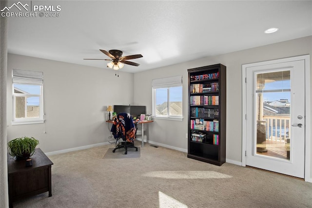 office area with ceiling fan and light colored carpet