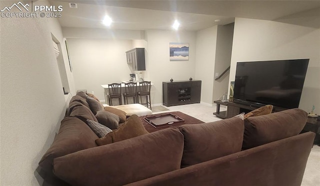 living room featuring light colored carpet