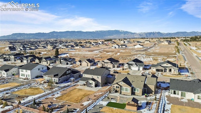 drone / aerial view featuring a mountain view