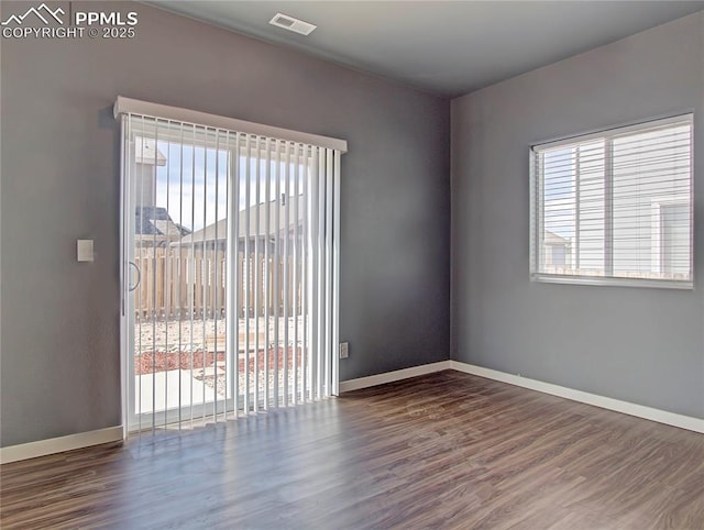 empty room featuring dark wood-type flooring