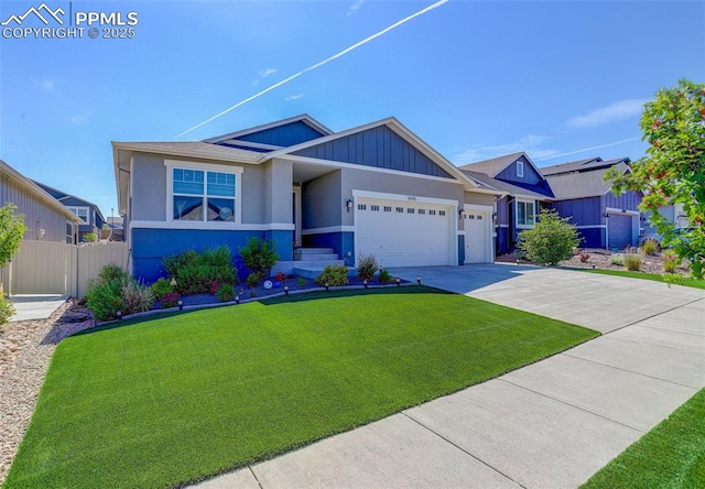 view of front of property featuring a garage and a front lawn