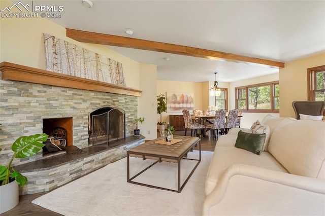 living room with beamed ceiling and wood-type flooring