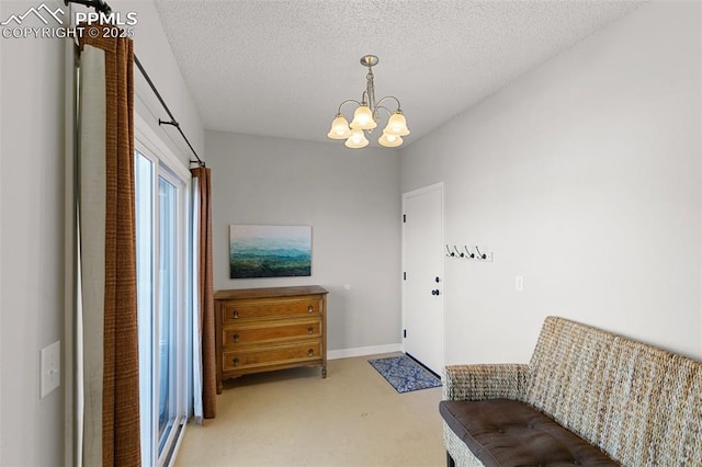 living area with carpet, an inviting chandelier, and a textured ceiling