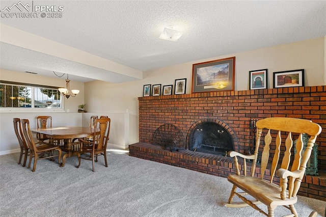 carpeted dining room featuring a brick fireplace, a notable chandelier, and a textured ceiling