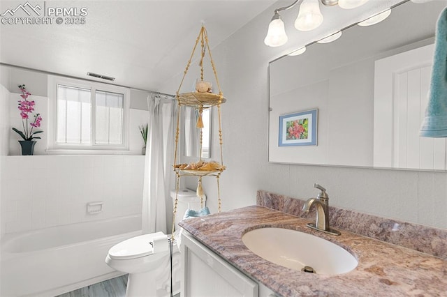 full bathroom with shower / bathtub combination with curtain, vanity, and toilet