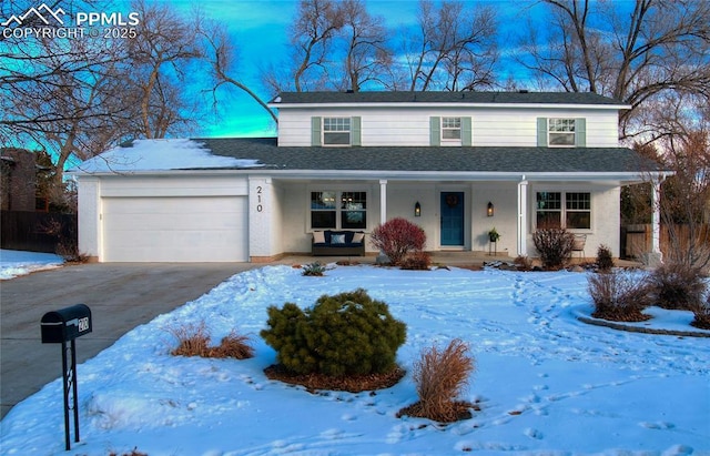 front facade featuring a garage and covered porch