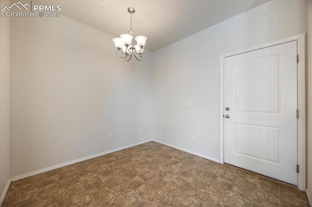 empty room with an inviting chandelier