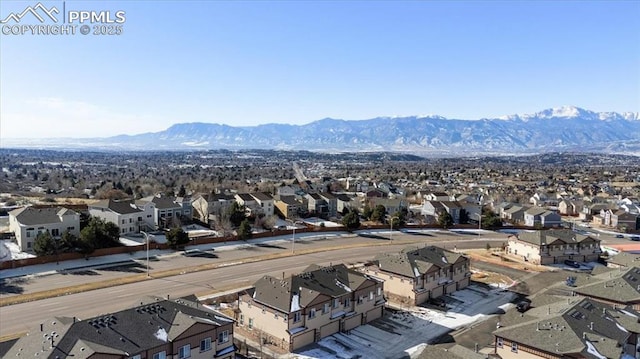 birds eye view of property with a mountain view