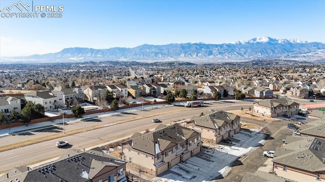 birds eye view of property featuring a mountain view