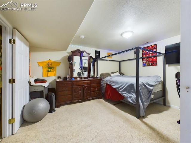 carpeted bedroom featuring a textured ceiling and visible vents