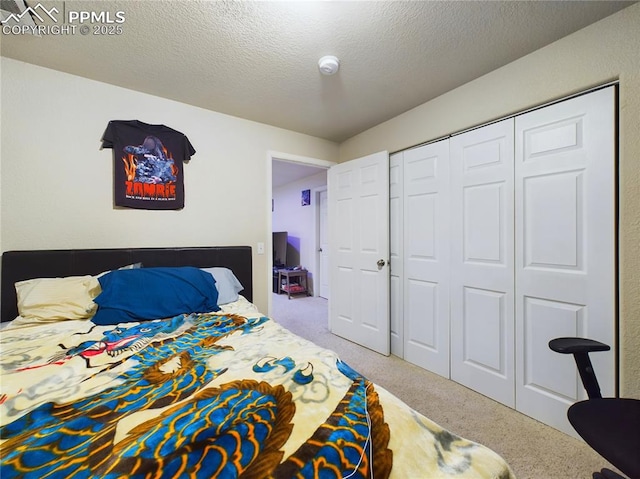 carpeted bedroom featuring a closet and a textured ceiling