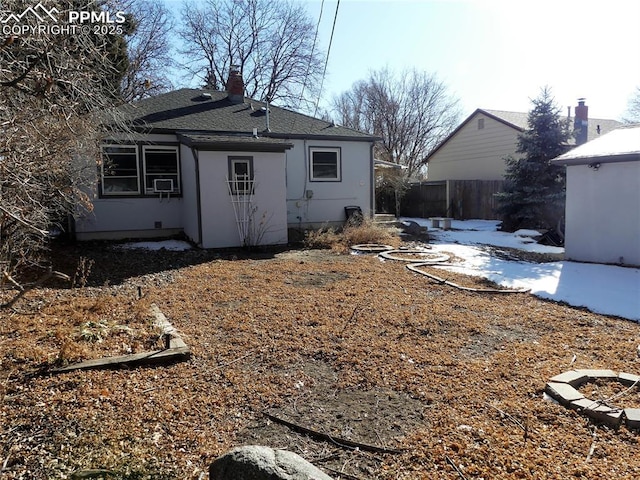 rear view of house with cooling unit