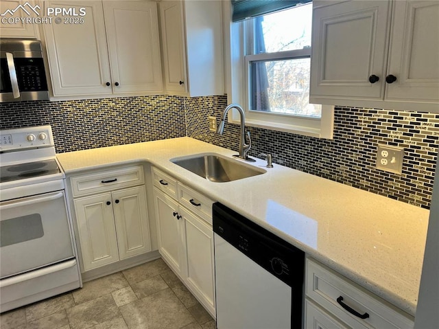 kitchen featuring dishwashing machine, sink, white cabinetry, decorative backsplash, and white electric stove