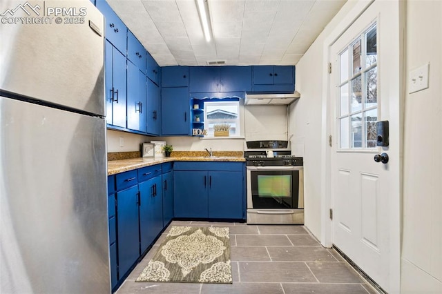 kitchen featuring light stone countertops, stainless steel appliances, sink, and blue cabinets